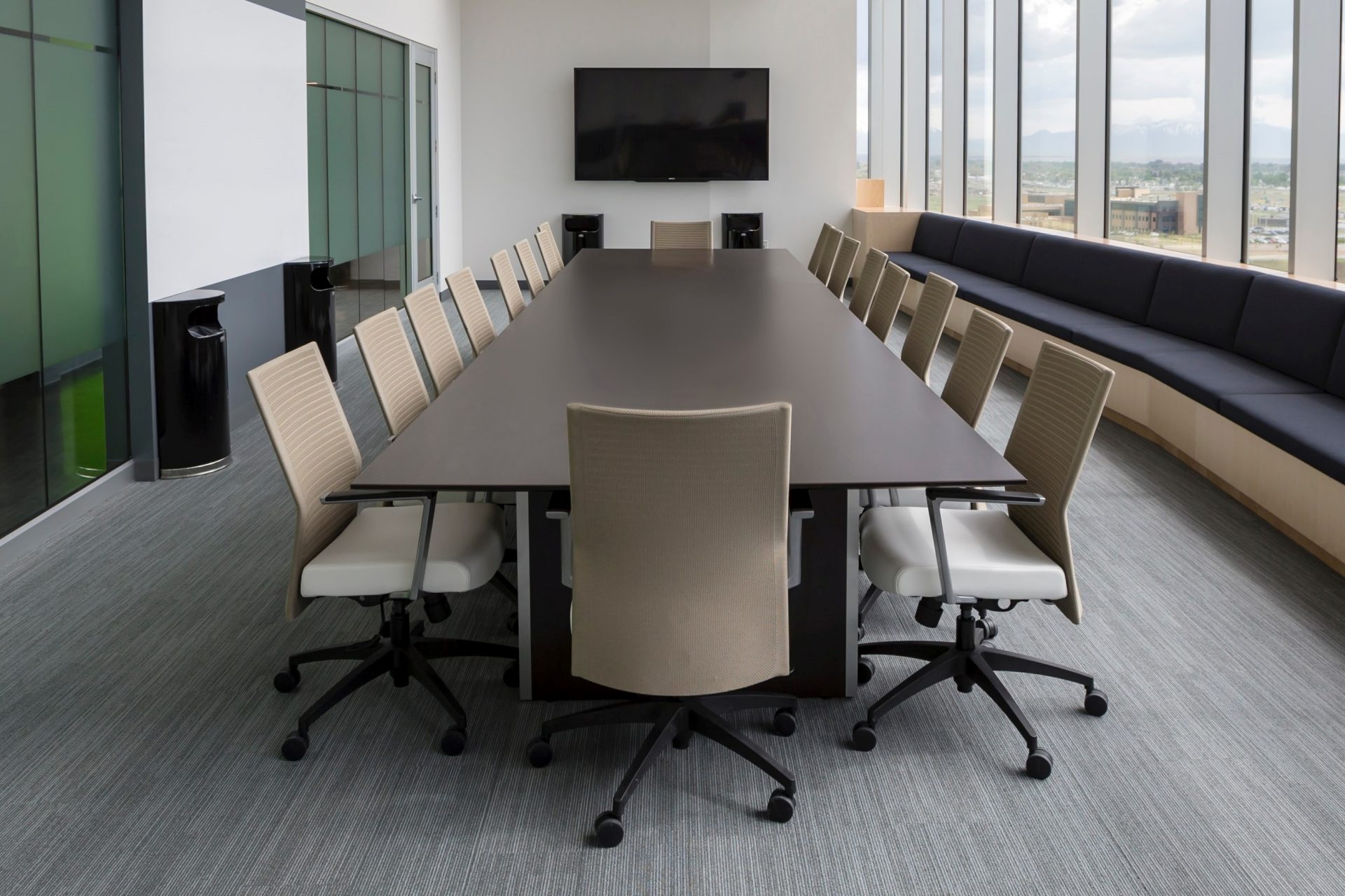 Photo of an empty board room table and chairs