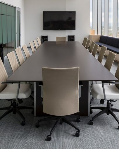Photo of an empty board room table and chairs