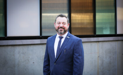 photo of Adam Costantini in a blue suit