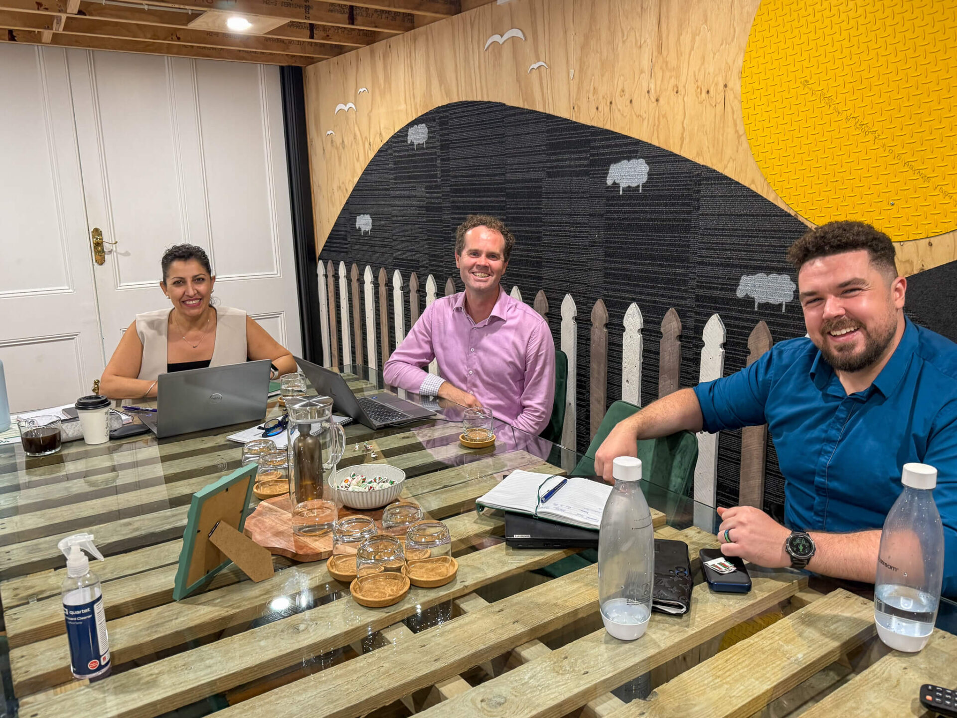 photo of three people in a meeting